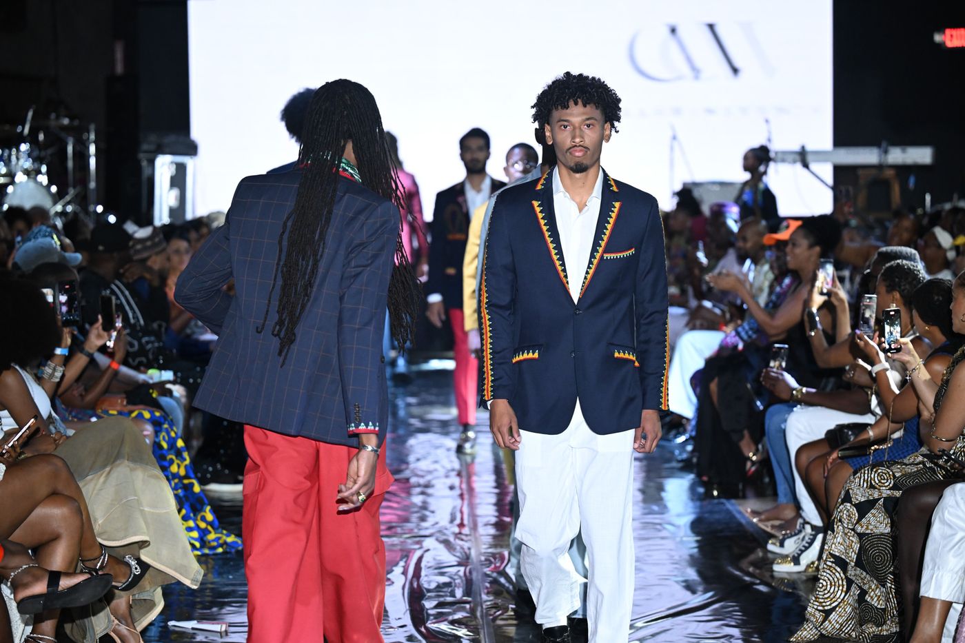 Model in a navy trimmed blazer over white at Ankara Festival LA