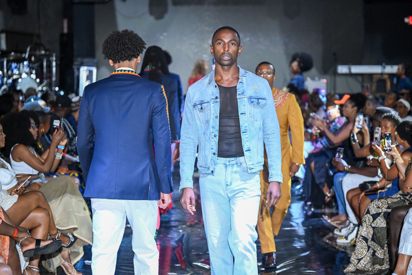 Model in a denim jacket look on the AFLA runway